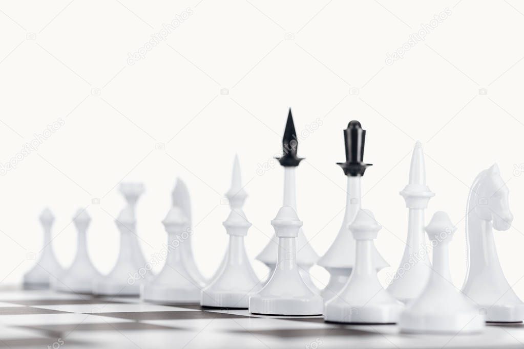 selective focus of chessboard with chess figures isolated on white