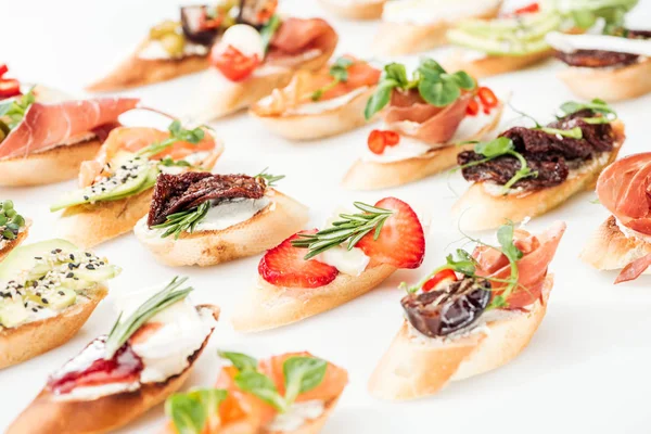 Selective Focus Italian Bruschetta Dried Tomatoes Prosciutto Avocado Strawberries Herbs — Stock Photo, Image