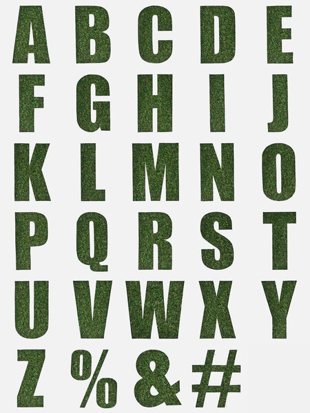 letters from English alphabet made of green grass isolated on white