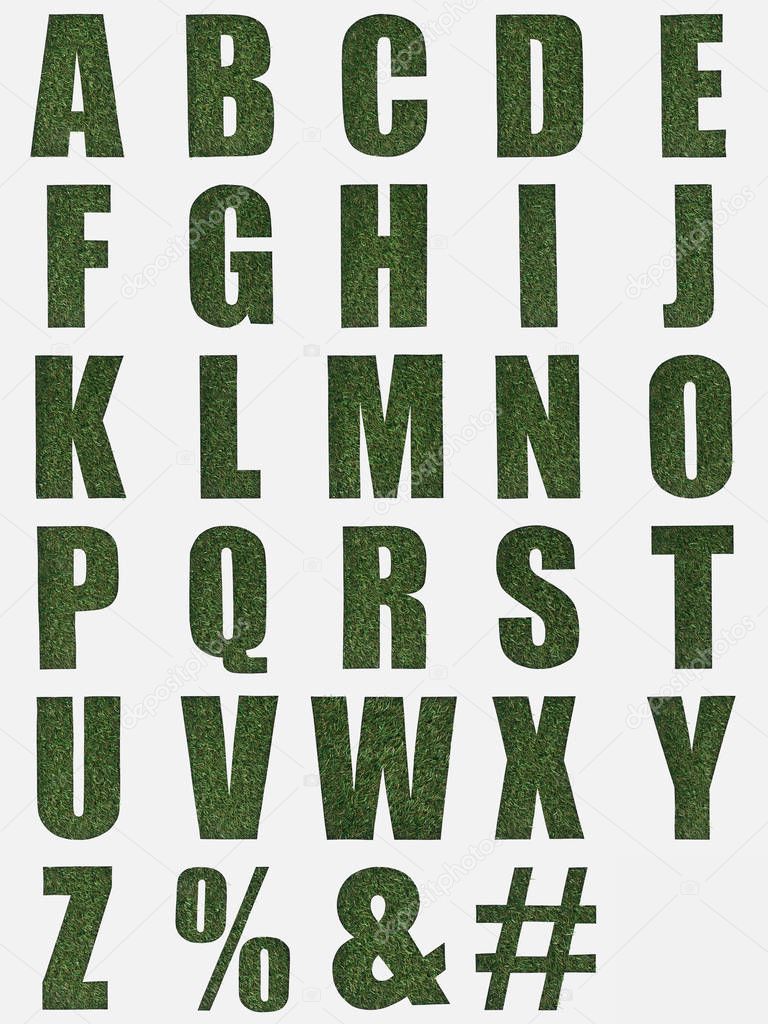 letters from English alphabet made of green grass isolated on white