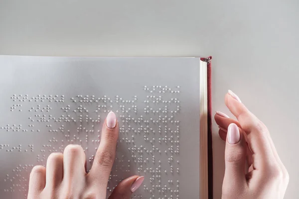 Top View Young Woman Reading Braille Text White Paper — стоковое фото