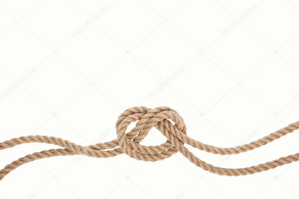 nautical jute and brown rope with sea knot isolated on white