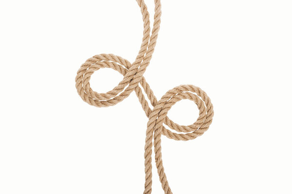 curled brown and jute ropes isolated on white 