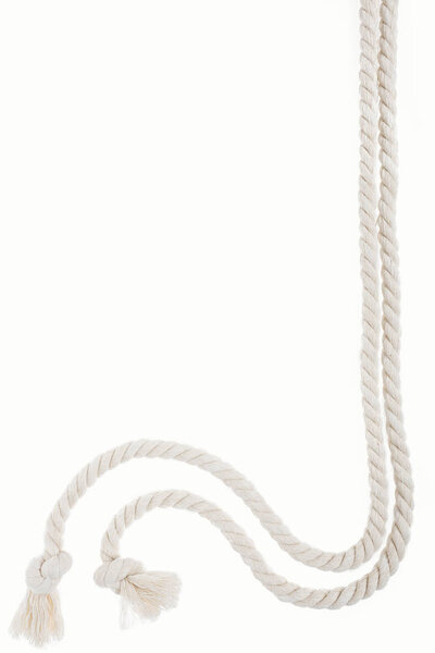 white long curled ropes with knots isolated on white