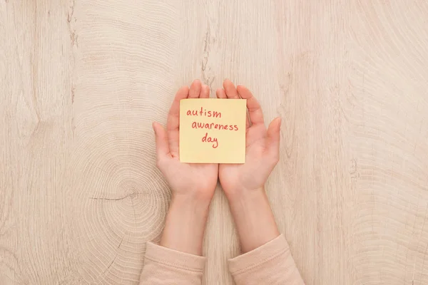 Cropped View Female Hands Sticky Note Red Autism Awareness Day — Stock Photo, Image