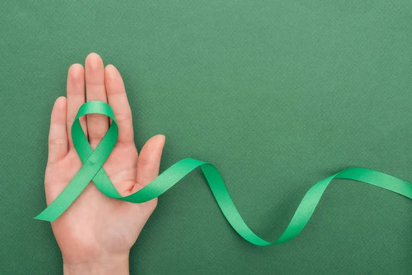 Cropped View Woman Holding Green Ribbon Green Background Copy Space — Stock Photo, Image