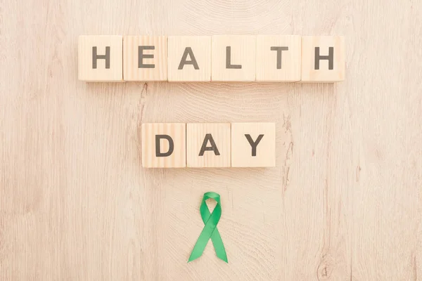 Top View Cubes Health Day Lettering Green Ribbon Wooden Background — Stock Photo, Image