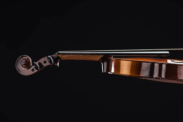 stock image close up of classic wooden violoncello isolated on black