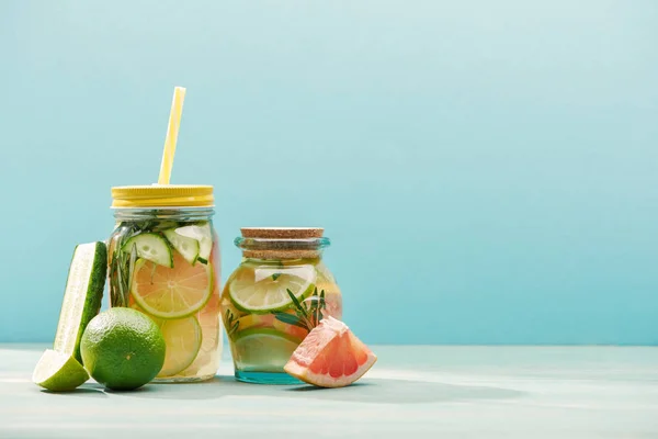 Fresh Detox Drinks Jars Limes Cucumber Grapefruit Isolated Blue — Stock Photo, Image