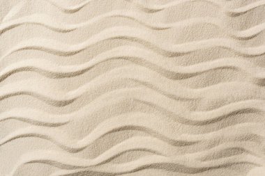 top view of textured background with sand and smooth waves  clipart