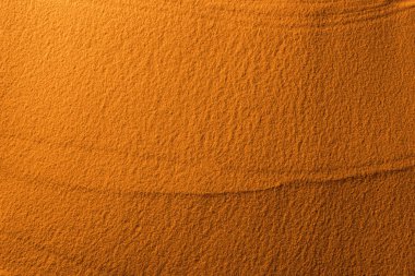 top view of textured sand with color filter and copy space clipart