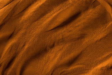 top view of textured beach sand with waves and orange color filter clipart