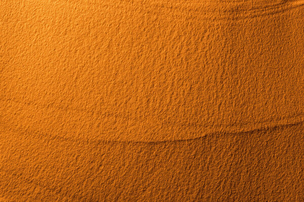 вид сверху текстурированного песка с цветным фильтром и копировальным пространством
