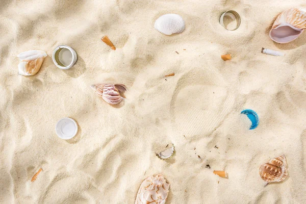 Top View Seashells Bottle Caps Scattered Cigarette Butts Plastic Bottle — Stock Photo, Image