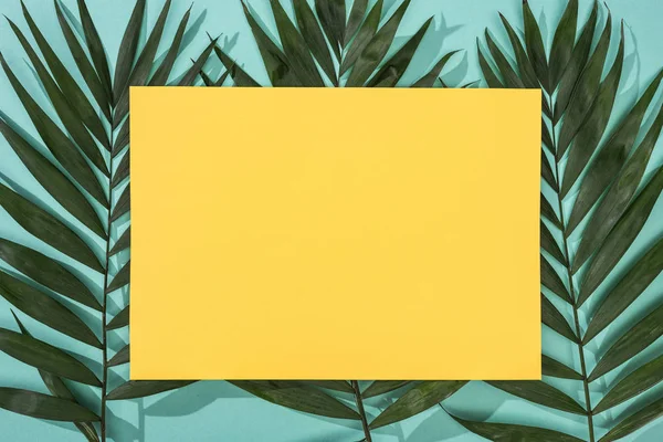 Top View Tropical Leaves Empty Yellow Card Turquoise Background — Stock Photo, Image