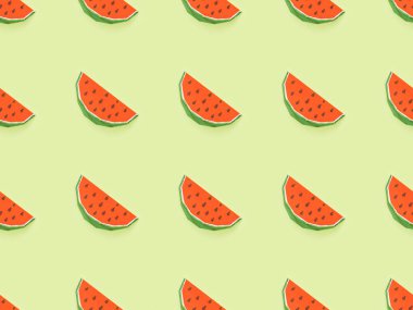 top view of seamless pattern with handmade red paper watermelon slices isolated on yellow clipart