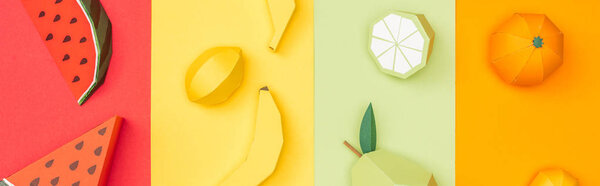 panoramic shot of various origami fruits on colorful paper stripes