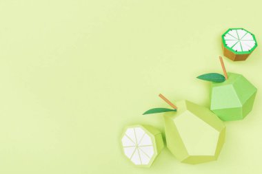 kopya alanı ile yeşil izole el yapımı kağıt kireç, limon, armut ve elma üst görünümü