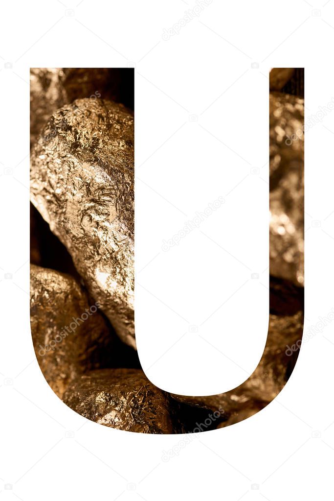 letter U made of shiny golden stones isolated on white