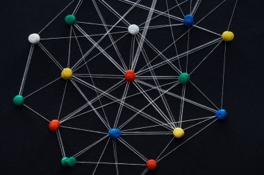top view of push pins connected with strings isolated on black, network concept clipart