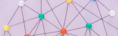 panoramic shot of colorful push pins connected with strings Isolated On pink, network concept clipart