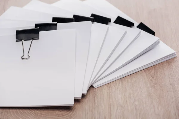 Stacks Blank Paper Metal Binder Clips Copy Space Wooden Desk — Stock Photo, Image