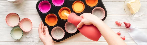 Panoramic Shot Woman Pouring Liquid Dough Muffin Mold Table — Stock Photo, Image