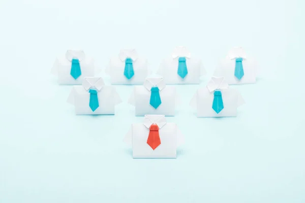 Origami White Shirts Blue Ties One Red Blue Background Leadership — Stock Photo, Image