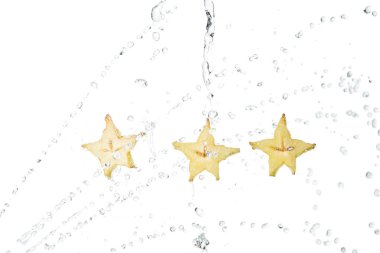 wet exotic star fruit slices and water drops isolated on white clipart