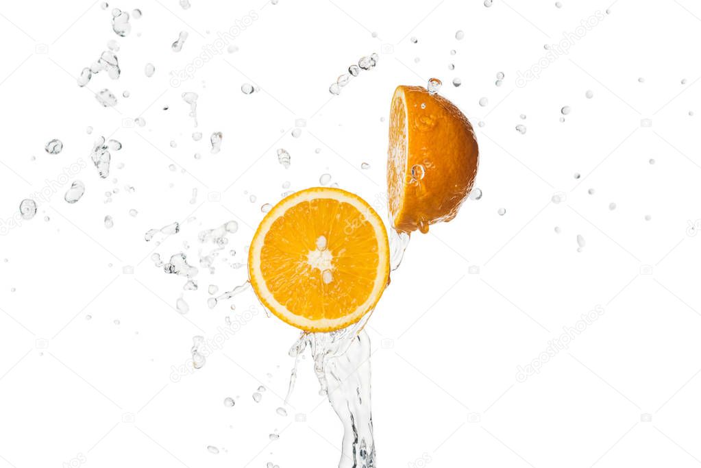 bright orange halves with water splash isolated on white