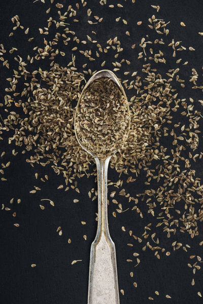 close up view of indian traditional spice in silver spoon