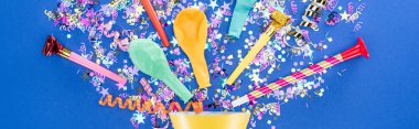 Panoramic shot of party hat with festive decor on blue background clipart