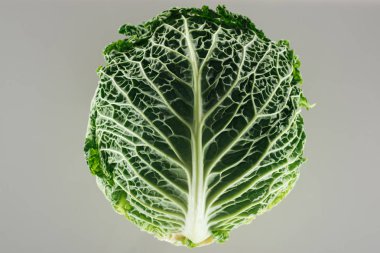 top view of green organic whole cabbage isolated on grey clipart