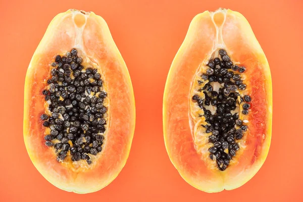 Top View Ripe Exotic Papaya Halves Black Seeds Isolated Orange — Stock Photo, Image