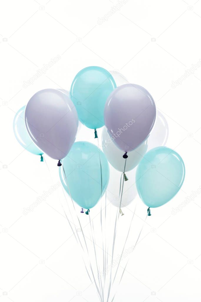 festive light blue, purple balloons isolated on white