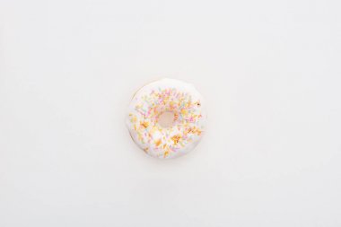 top view of glazed white doughnut with sprinkles on white background with copy space clipart