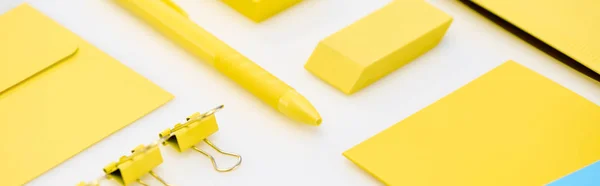 Panoramic Shot Yellow Pen Paper Clips Eraser Stickers Envelope White — Stock Photo, Image