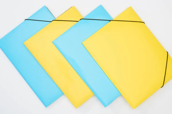 Flat Lay Yellow Blue Folders White Background — Stock Photo, Image