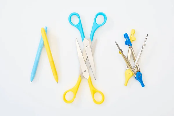 Top View Yellow Blue Scissors Pens Compasses White Background — Stock Photo, Image