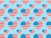 seamless background pattern with paper cut hearts made of american flags on blue 