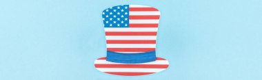 top view of paper cut decorative hat made of american flag on blue background, panoramic shot  clipart