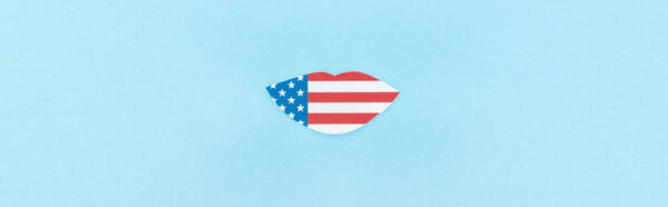 panoramic shot of paper cut decorative lips made of american flag on blue background 