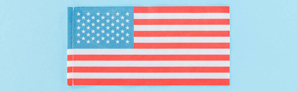 panoramic shot of national american flag on blue background
