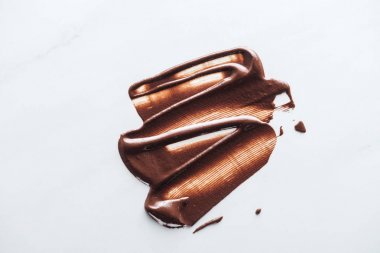 Top view of liquid dark chocolate on white background clipart
