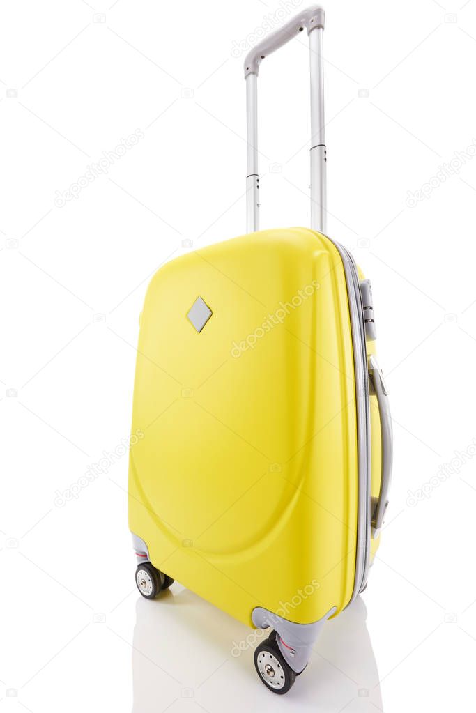 yellow plastic wheeled colorful suitcase with handle isolated on white