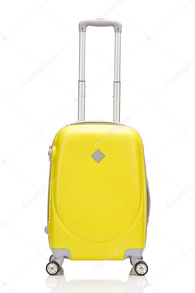 front view of yellow plastic wheeled colorful suitcase with handle isolated on white