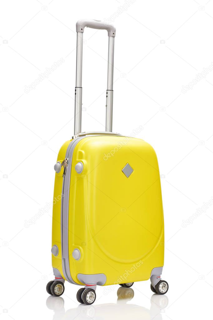 yellow wheeled colorful suitcase with handle isolated on white