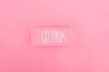top view of card with go pink lettering on pink background, breast cancer concept clipart