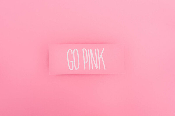 top view of card with go pink lettering on pink background, breast cancer concept