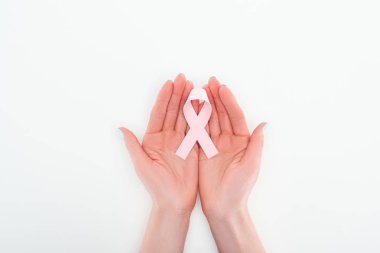 partial view of woman holding in hands pink breast cancer sign on white background clipart